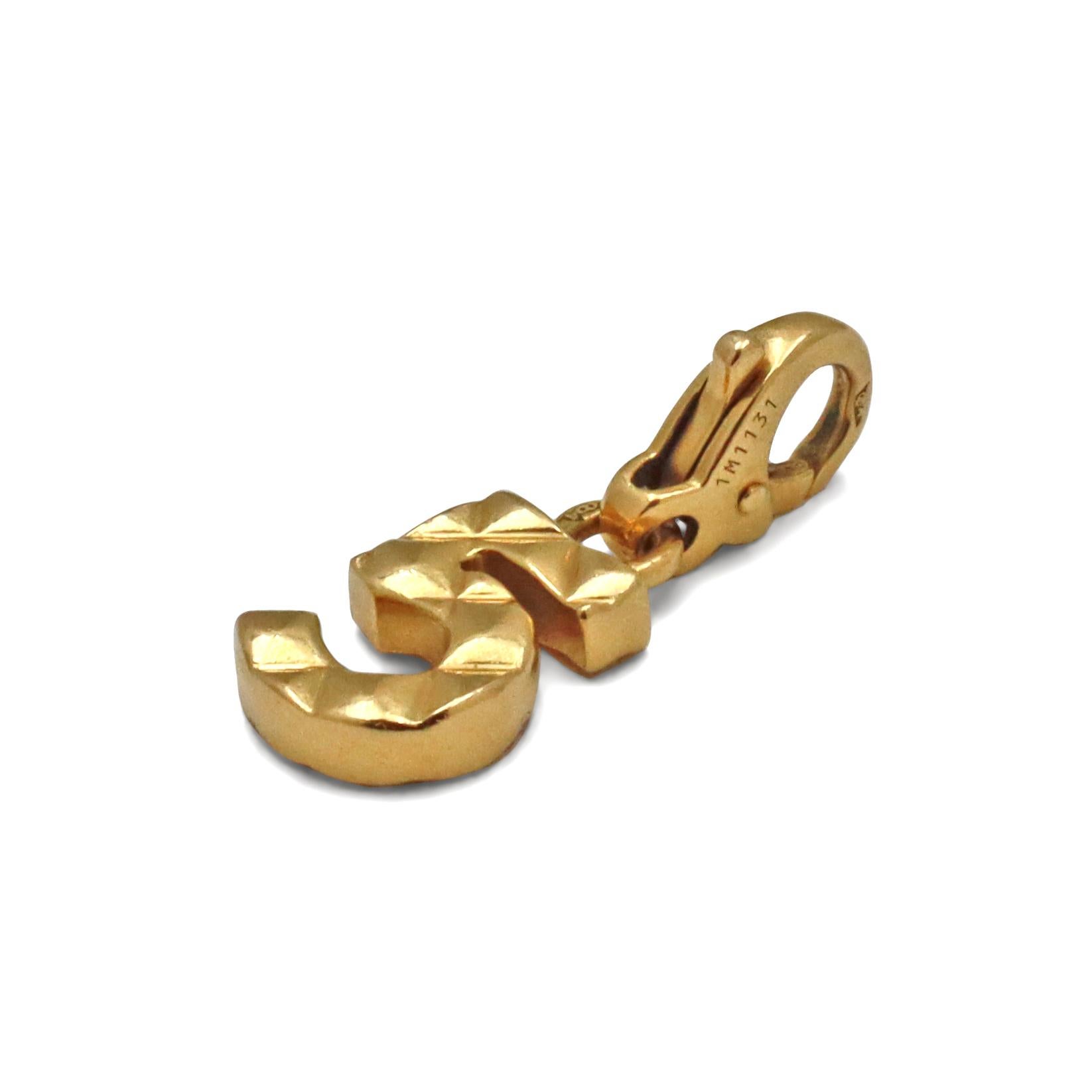 Authentic Chanel No 5 charm crafted in 18 karat yellow gold. Inspired by Chanel's famous No 5 L'Eau perfume. The charm measures 21mm in length and 8mm in width. Signed Chanel, 750, with serial number. The charm is not presented with the original box