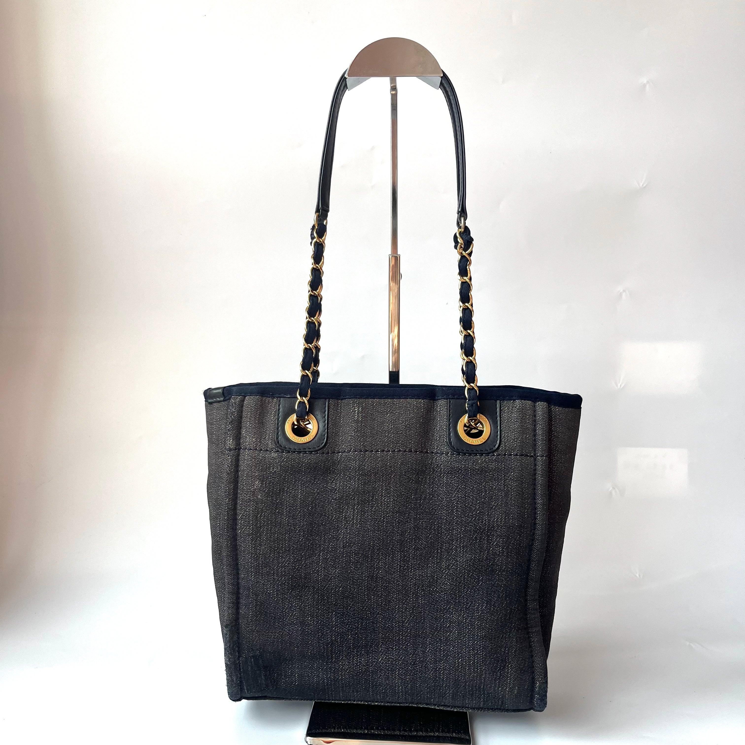 Chanel North South Deauville Tote Small Navy Denim Top Handle Shoulder Bag, 2012-2013

  The Chanel Deauville Tote bag is a stylish accessory for everyday use. Crafted from durable denim, this tote is perfect for all season wear. Despite signs of