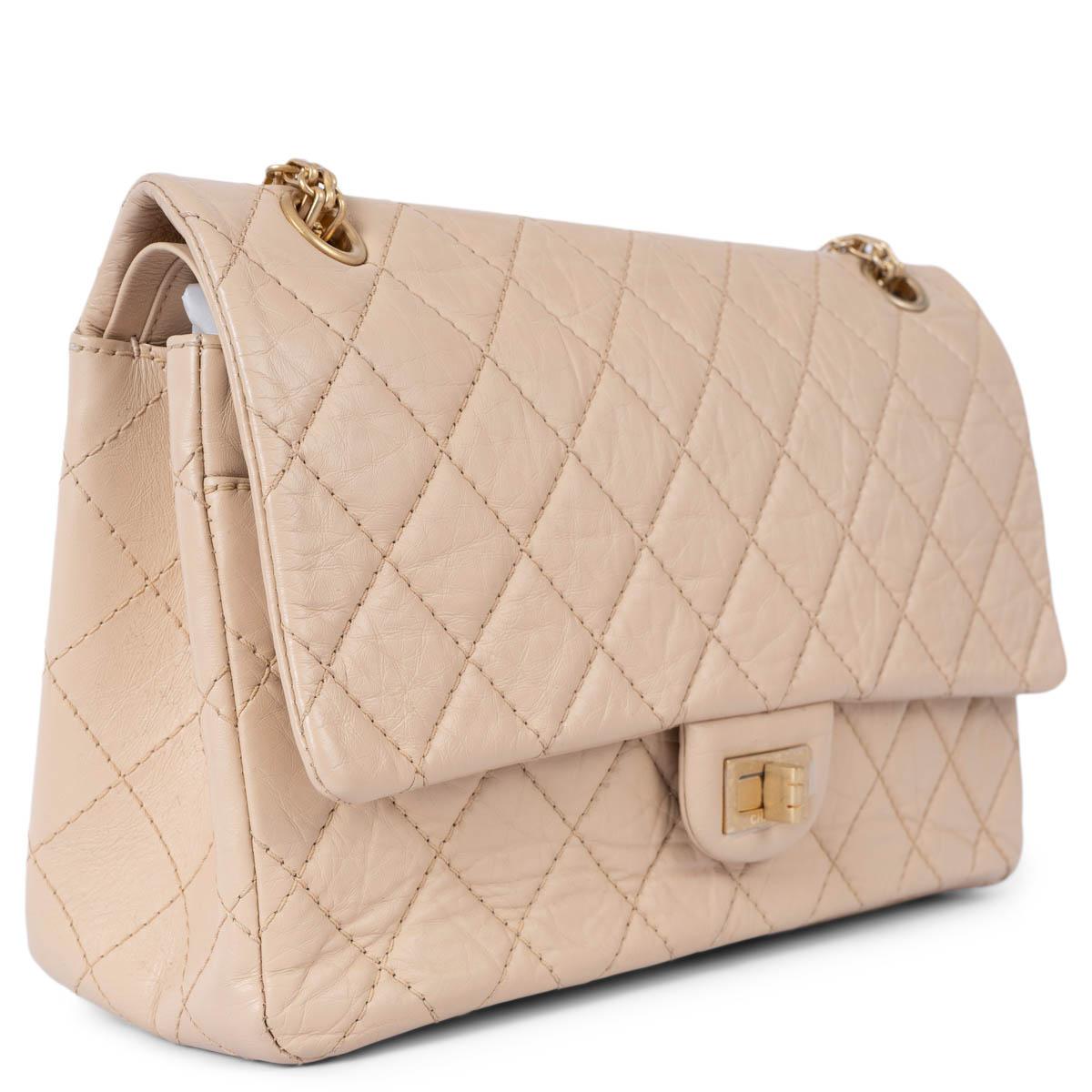 100% authentic Chanel Large 2.55 Reissue 226 double flap bag in nude aged calfskin featuring classic diamond quilted stitchings. Opens with a turn-lock to a black and burgundy smooth calfskin interior with two patch pockets and one lipstick pocket
