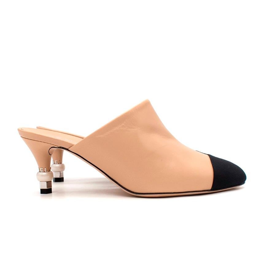 Chanel Nude-Beige Leather Toe-Cap Pearl Embellished Heel Mules
 

 - Signature Chanel style, featuring a contrasting black grosgrain toe-cap
 - Upper rendered in supple, smooth leather in a chic nude-beige tone
 - Silver-tone metal CC logo on outer
