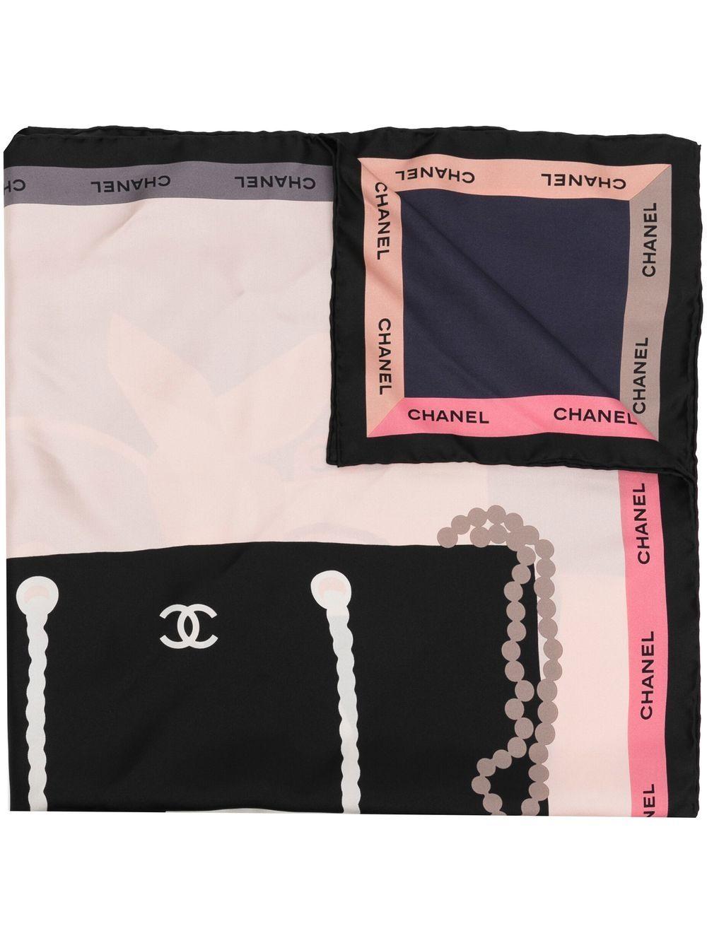 Displaying a large motif of Chanel's iconic bags, this pre-owned silk scarf has been designed in the shades of black, white, red and blue. Finished with a border of Chanel's famous logo, wear it around your neck or in your hair. 

Colour: