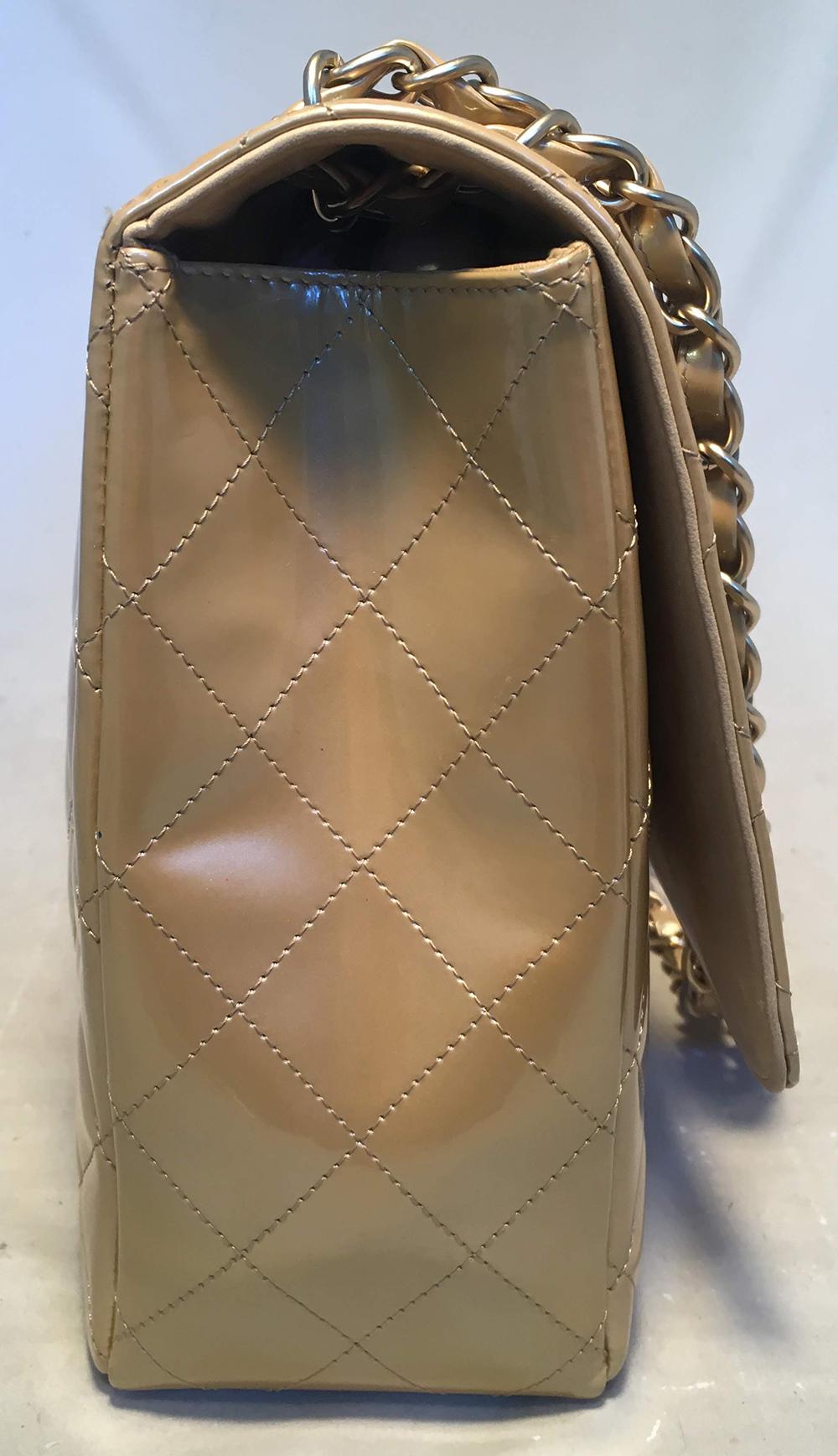 RARE Chanel Nude Gold Pearlized Patent Leather Maxi Classic Flap Shoulder bag in excellent condition. Gold quilted pearlized patent leather exterior trimmed with matte gold hardware. Woven chain and leather shoulder strap. Exterior back side slit