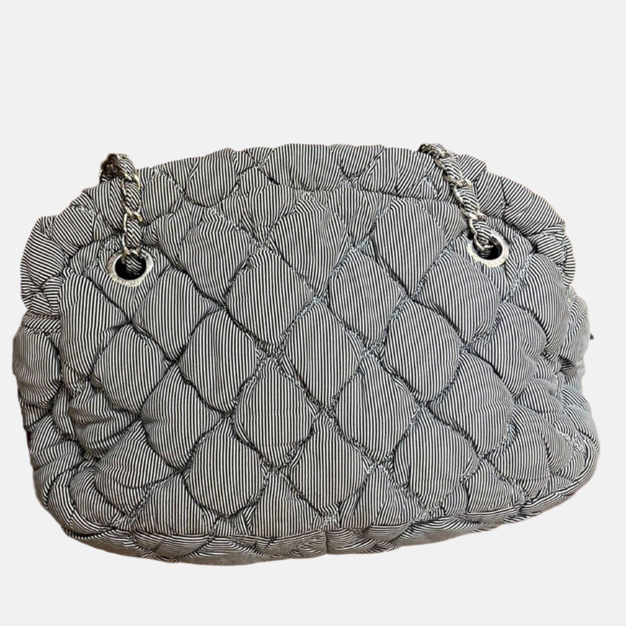Chanel Nylon Bubble Striped Quilt Accordion Flap Bag Blue, 2009-2010
 These are professional photos of the actual bag offered
 VDiscover the perfect balance of style and functionality with the Chanel Nylon Bubble Striped Quilt Accordion Flap Bag.
