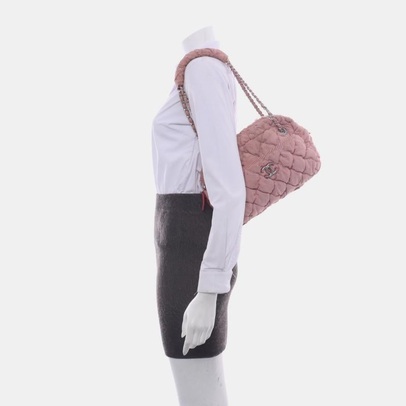 Chanel Nylon Bubble Striped Quilt Accordion Flap Bag Pink, 2009-2010
These are professional photos of the actual bag.
  Discover the perfect balance of style and functionality with the Chanel Nylon Bubble Striped Quilt Accordion Flap Bag. Made with