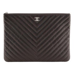 Chanel O Case Clutch Chevron Aged Calfskin with Studded Detail Medium