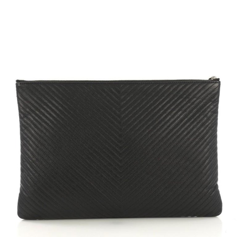 Chanel O Case Clutch Chevron Caviar Large, crafted from black c at 1stDibs