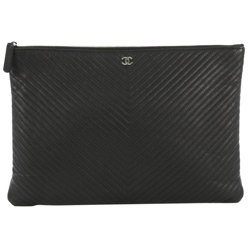 Chanel O Case Clutch Chevron Caviar Large, crafted from black c