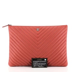 Chanel O Case Clutch Chevron Caviar Large