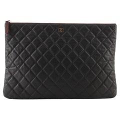 Chanel O Case Clutch Quilted Caviar Large