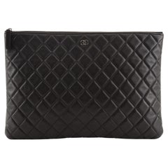 Chanel O Case Clutch Quilted Lambskin Large