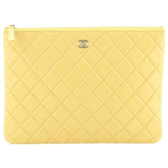 Chanel O Case Clutch Quilted Lambskin Medium