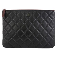 Chanel O Case Clutch Quilted Lambskin Small