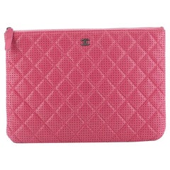 Chanel O Case Clutch Quilted Perforated Lambskin Medium