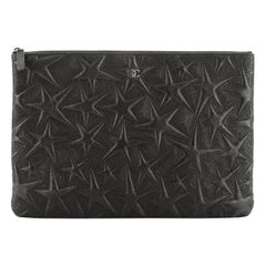 Chanel O Case Clutch Star Embossed Lambskin Large 