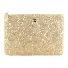 Chanel O Case Clutch Star Embossed Lambskin Medium