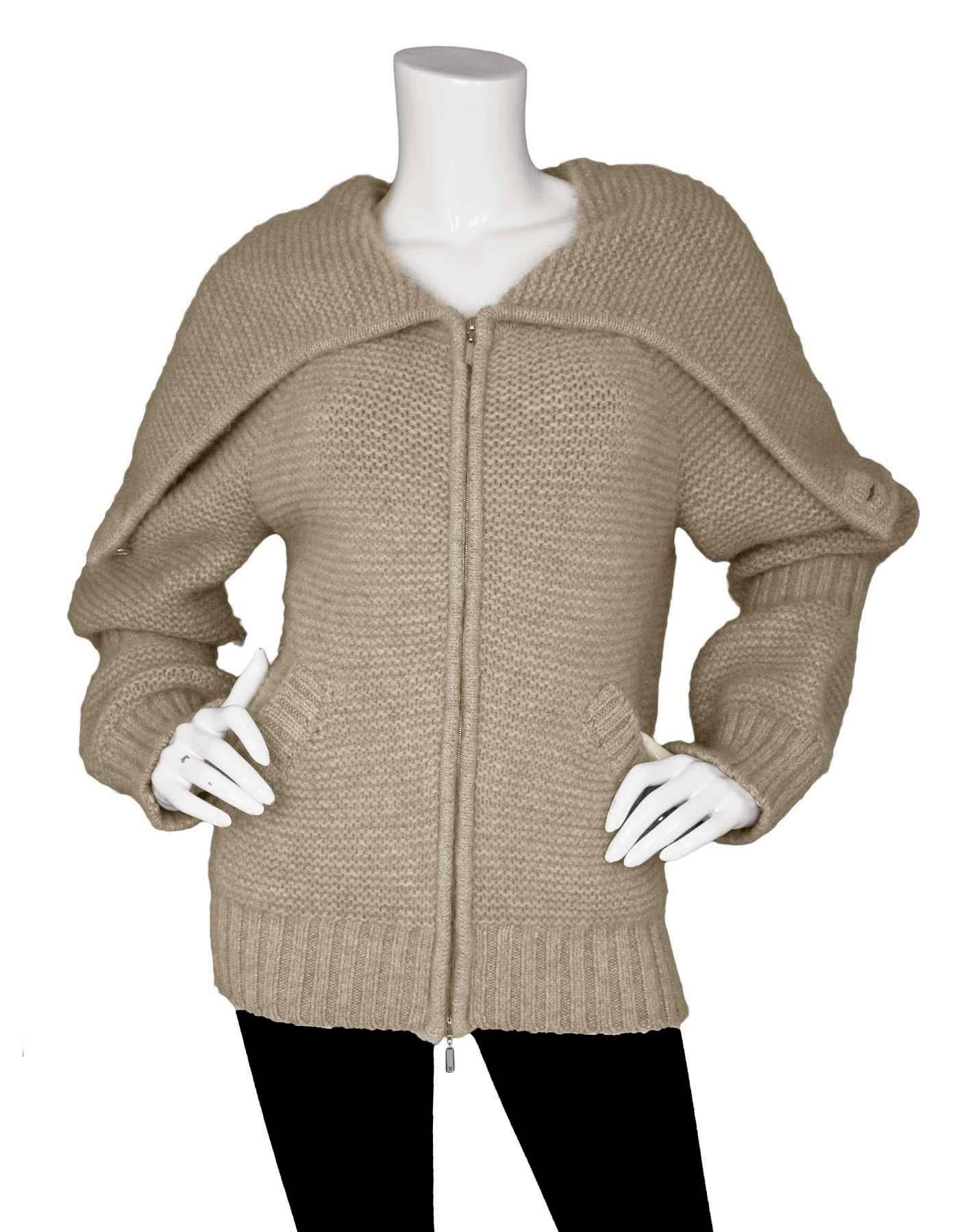 Chanel Oatmeal Cashmere Knit Sweater Sz FR38

Made In: France
Year Of Production: 2007
Color: Oatmeal
Materials: 84% cashmere, 15% mohair, 1% spandex
Lining: None
Closure/Opening: Front double zip closure
Exterior Pockets: Slit pockets at