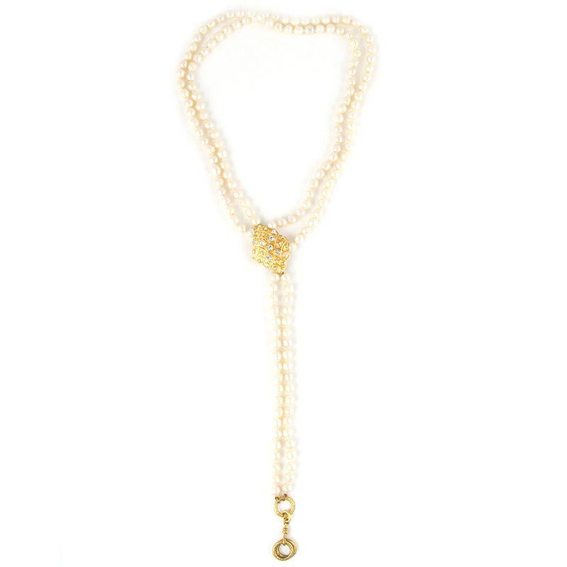 Chanel deconstructed necklace in off-white faux pearls and gold-tone metal with clear rhinestones. Has been worn and is in excellent condition.