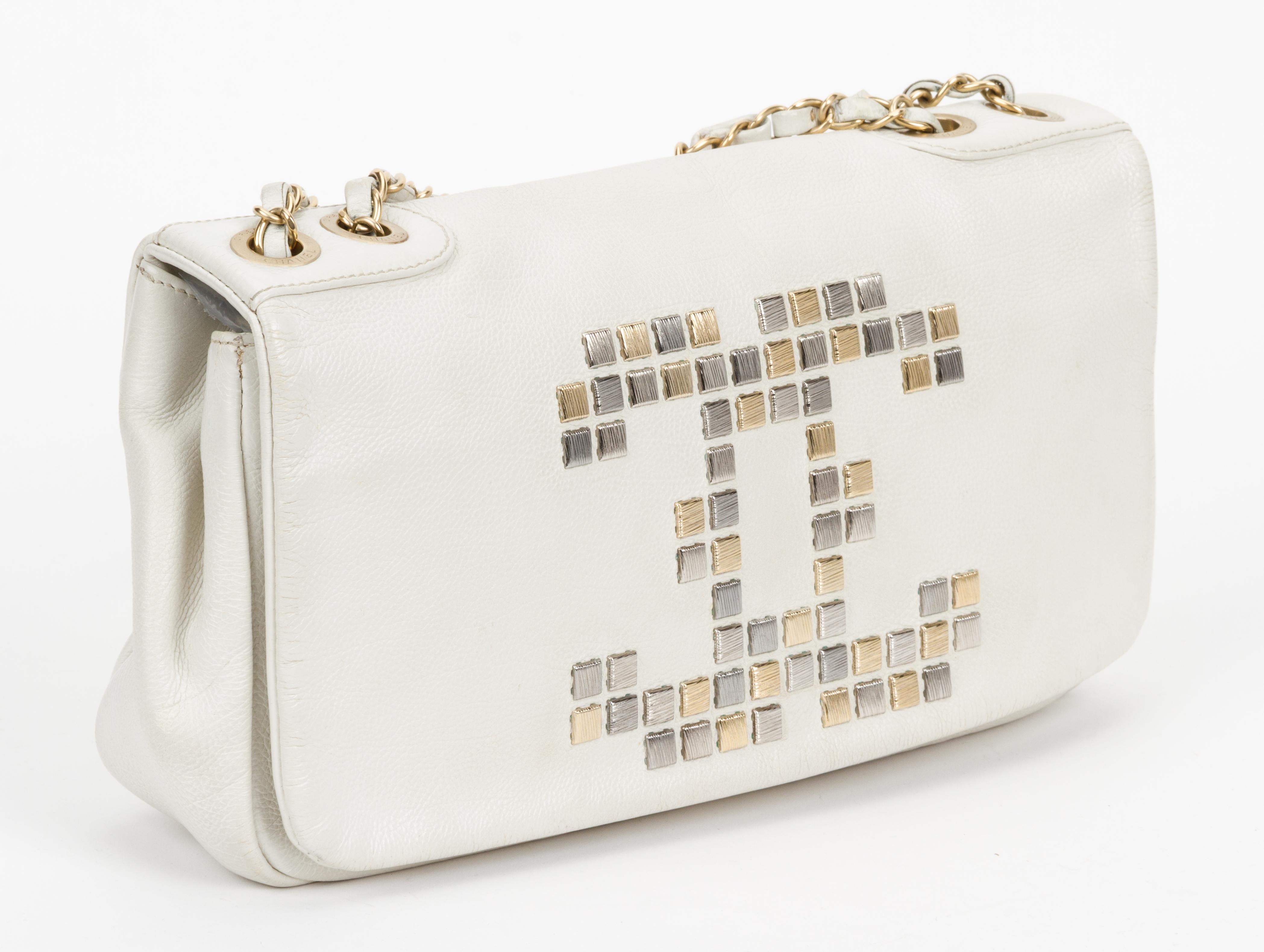 Chanel off white pebbled leather shoulder bag with gold and silver mosaic CC logo design. Shoulder drop 9