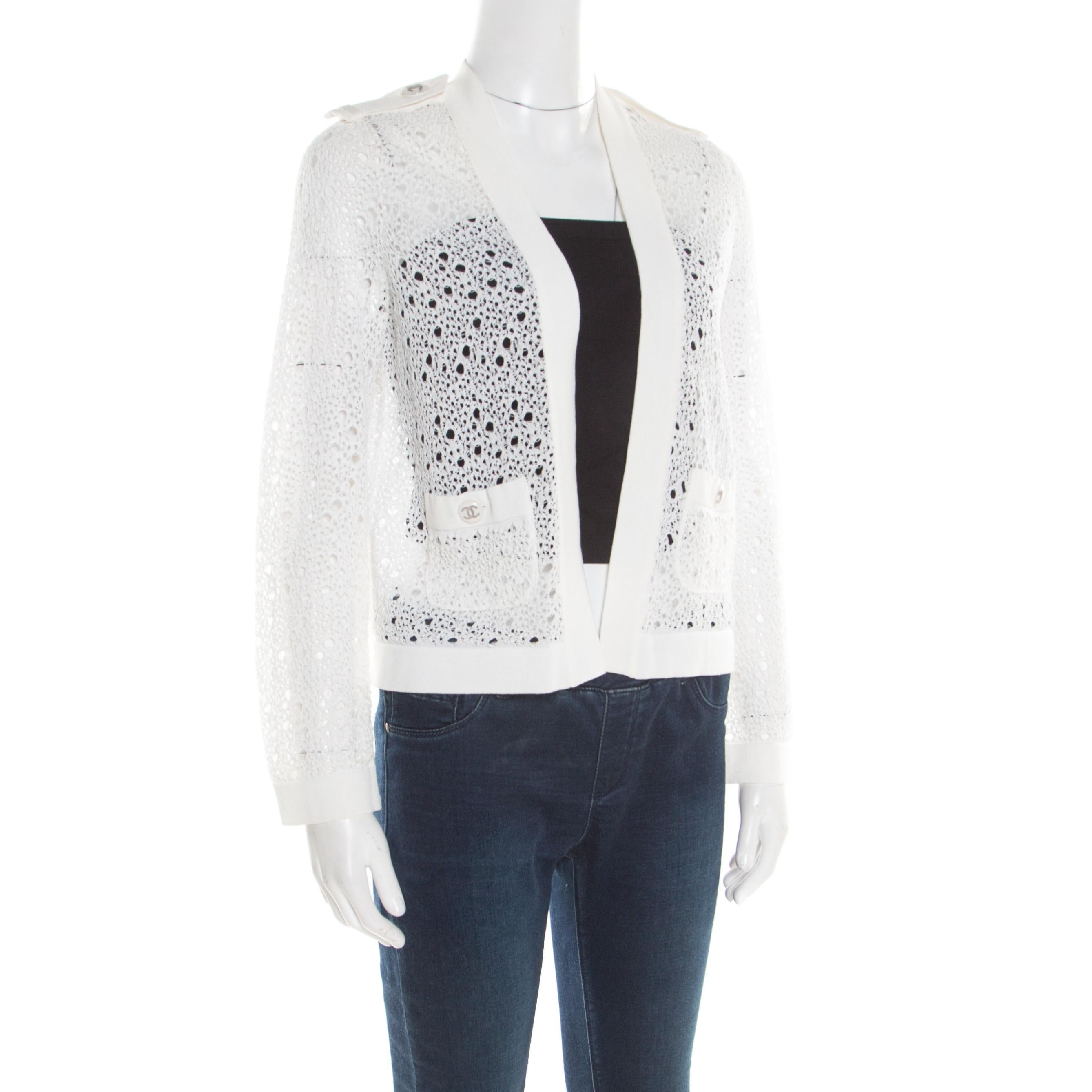This cardigan from Chanel is well-crafted and absolutely gorgeous. In a stunning shade of off-white, this cardigan features long sleeves, front pockets, and button fastenings. Knit to perfection, this piece is wonderful enough to help you look ultra