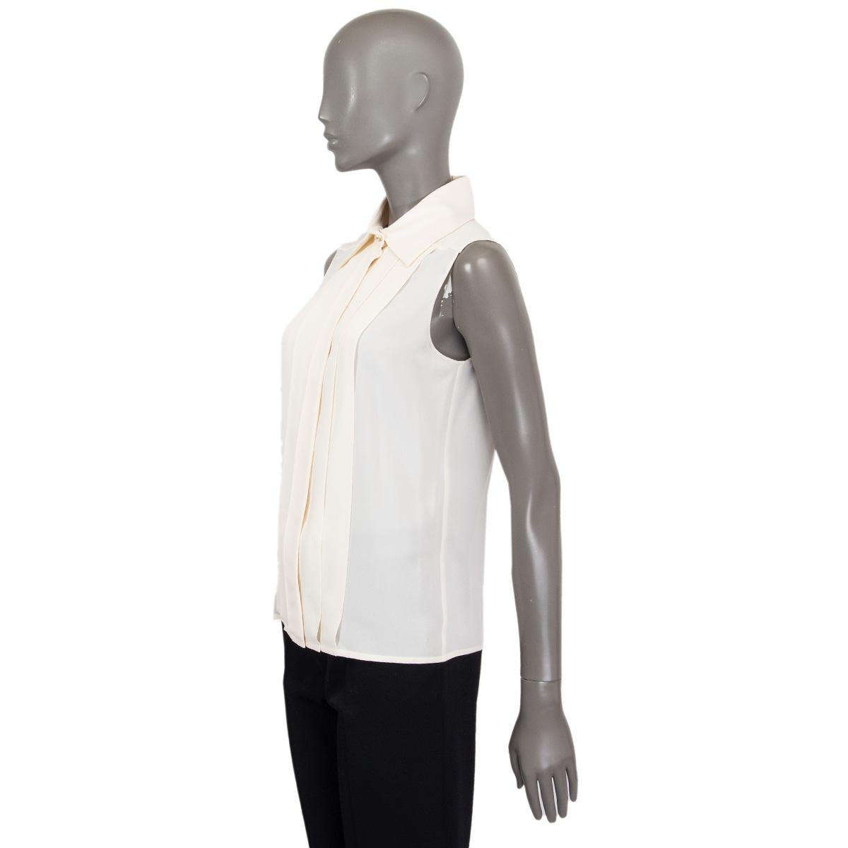 white silk sleeveless blouse