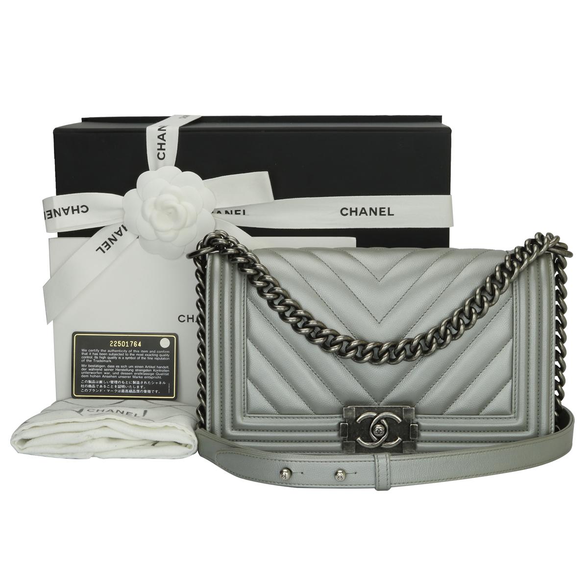 Authentic CHANEL Old Medium Chevron Boy Bag Silver Caviar with Ruthenium Hardware 2016.

This stunning bag is still in a mint condition; it still keeps its original shape and the hardware still very shiny.

Exterior Condition: Mint condition,