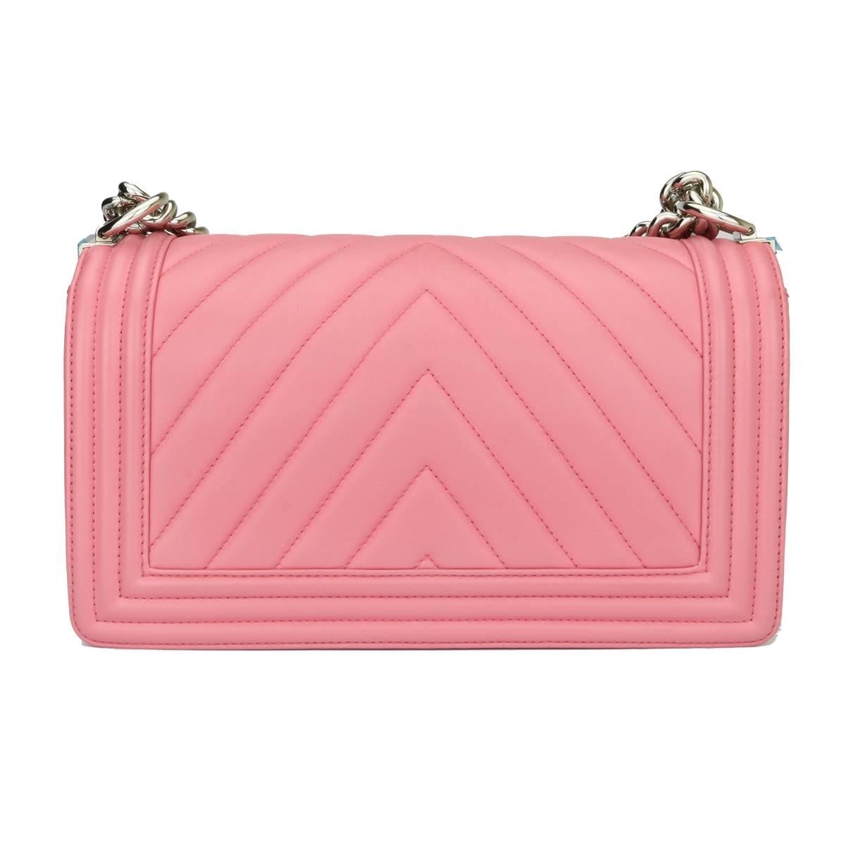 Authentic Chanel Old Medium Chevron Boy Pink Calfskin with Shiny Silver Hardware 2016.

This stunning bag is still in Mint condition, the bag still holds its original shape and the hardware is still very clean and shiny.

Exterior Condition: Mint