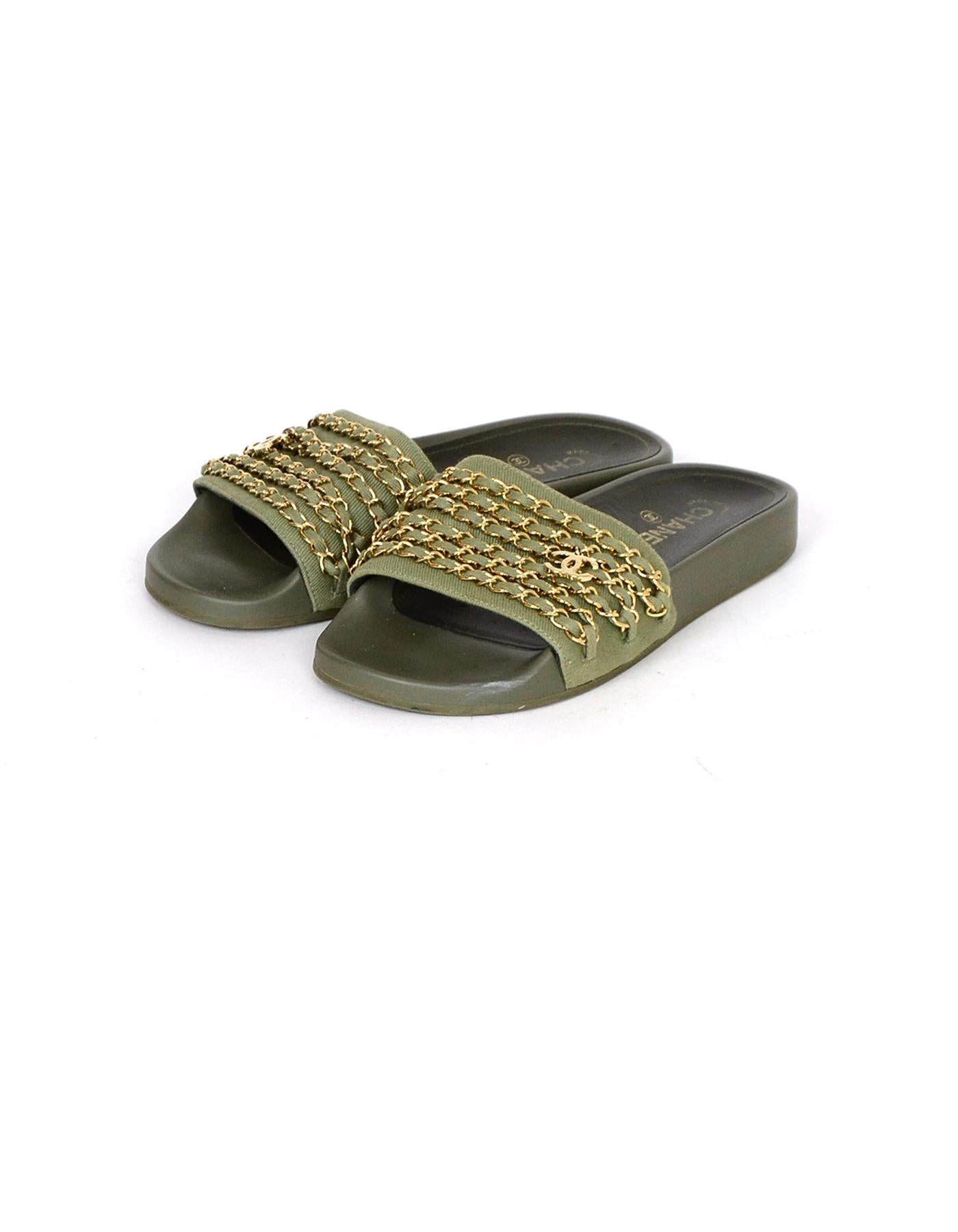 Chanel Olive Green/Gold Canvas Chain Slide Sandals w/ CC

Made In: Italy
Color: Olive green, gold
Hardware: Goldtone
Materials: Leather, canvas, rubber
Closure/Opening: Slide on
Overall Condition: Excellent pre-owned condition, with the exception of