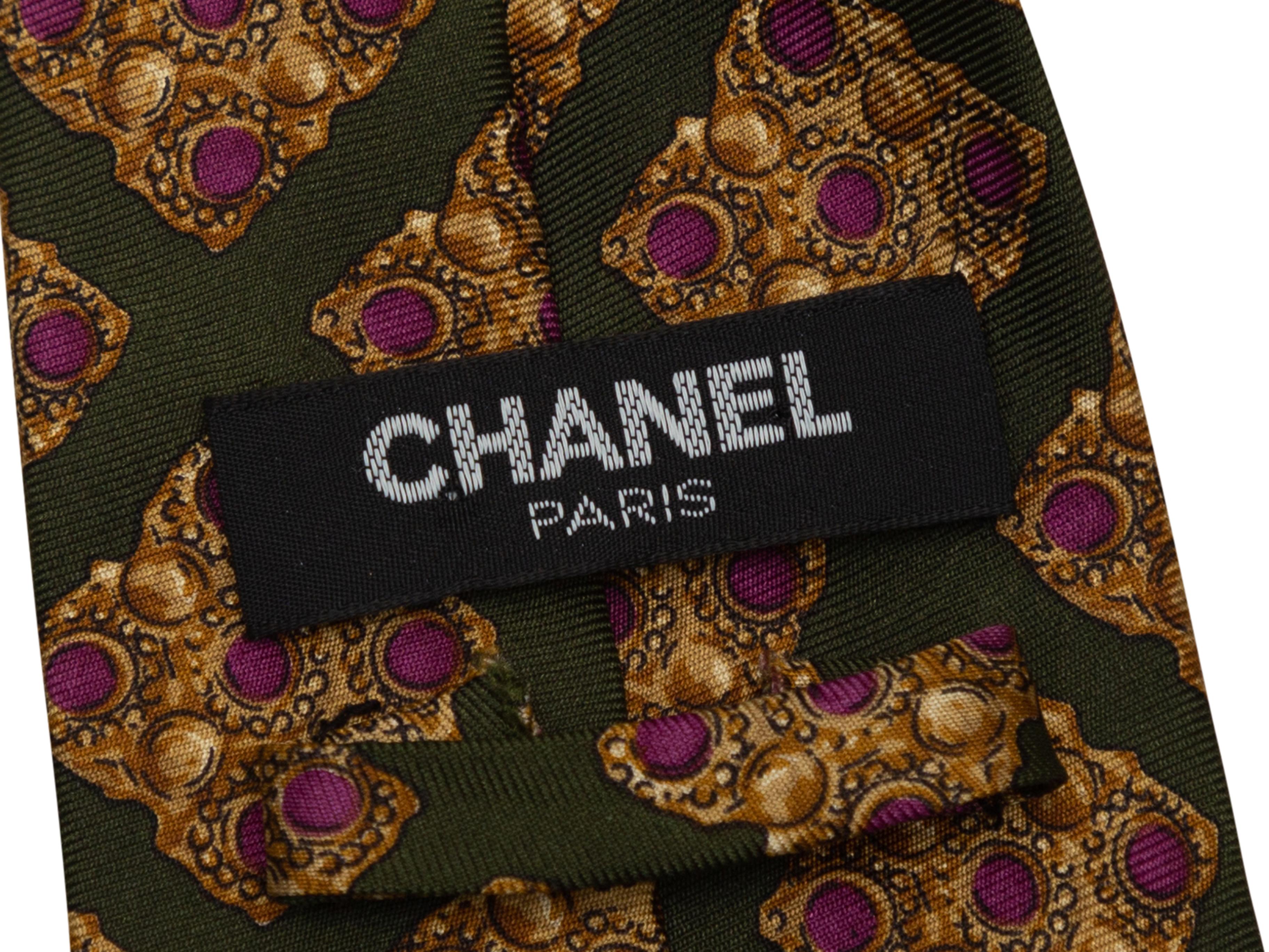 Product Details: Olive green, gold and burgundy printed tie by Chanel. 57