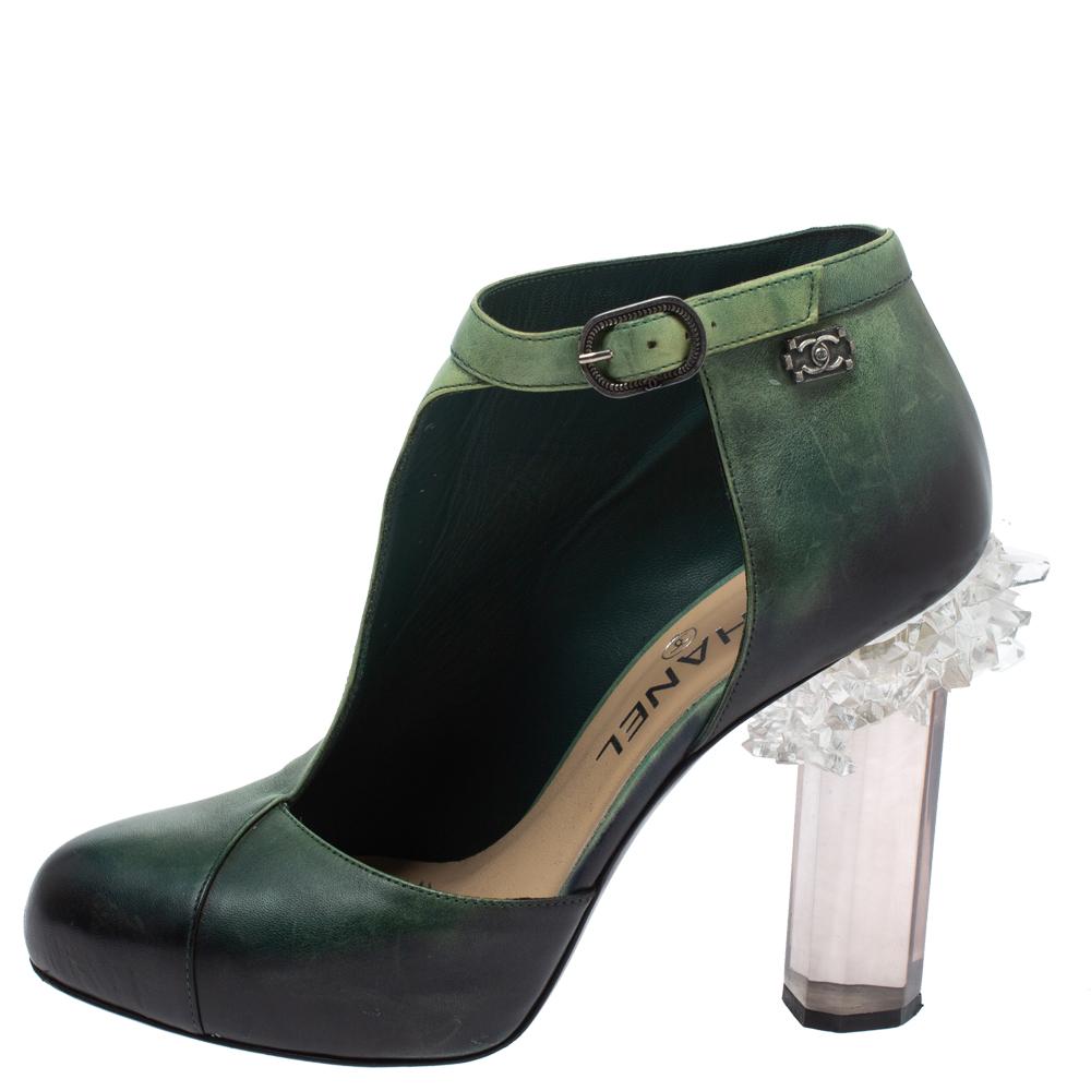 Exhibiting beauty with every detail, these ankle boots by Chanel are sure to look great on you. Crafted from ombre green leather, they feature round toes, half D'orsay cuts, ankle fastening, and crystal-embellished heels.

Includes: Original Dustbag
