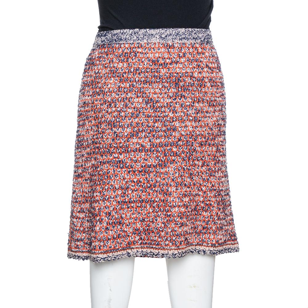 We bring you your best buy of the year in the form of this skirt from Chanel. The skirt is woven from quality fabrics and it has a textured design in blue and orange and a hem ending above the knees. This creation is lovely and worthy of a place in