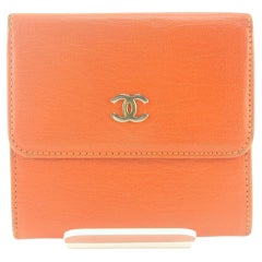 Portefeuille à trois volets compact CC orange Chanel 2CC712K