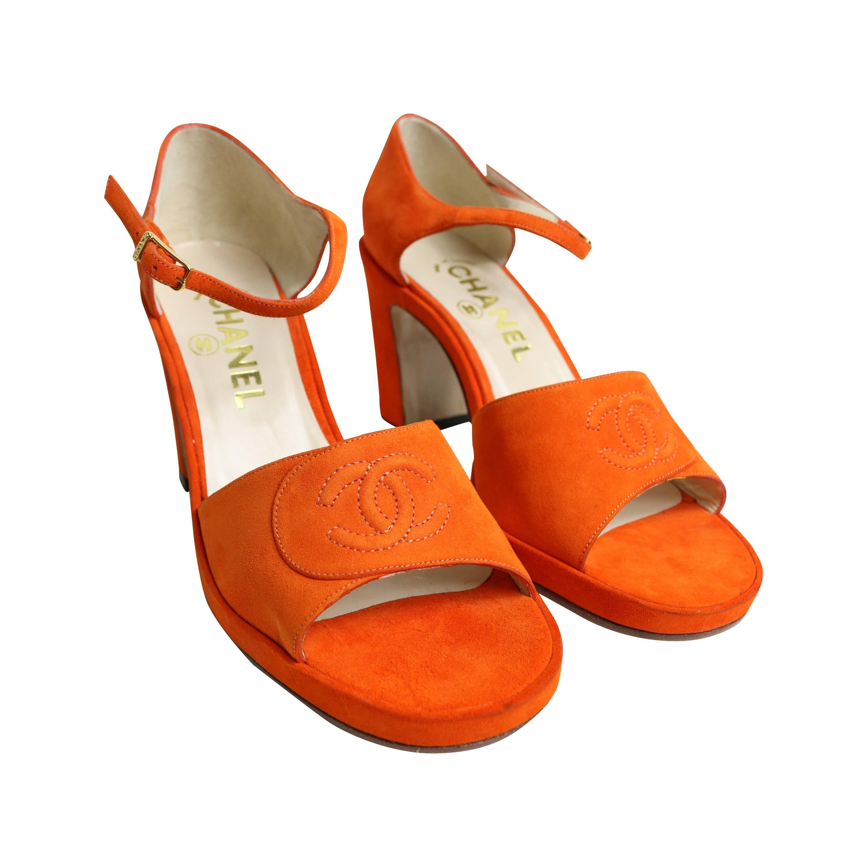 - Vintage 90s Chanel orange suede embroidered CC open toe strap heels.

- Featuring a 
