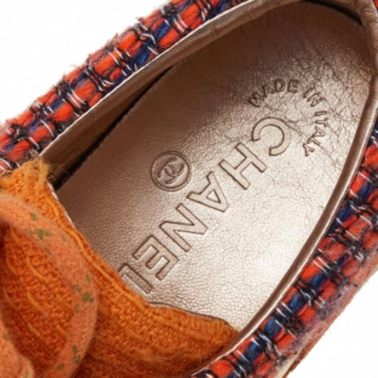 Add a touch of luxury to your casual-sporty look with these stunning Chanel sneakers. Beautifully constructed with tweed fabric, suede, and leather, they feature round toes and chunky midsoles. The lace-ups complete the orange pair with effortless