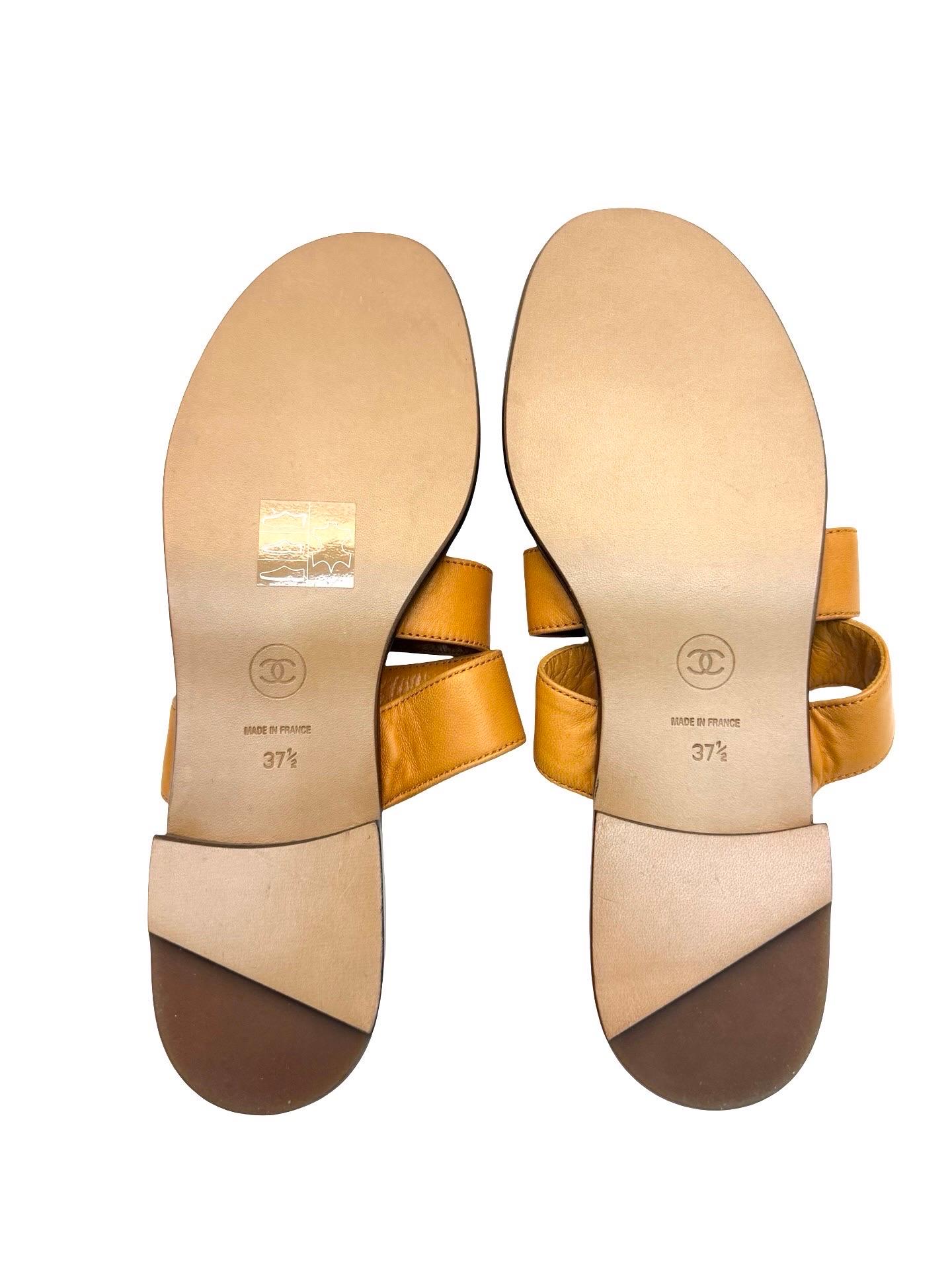 - Unworn Chanel 90's orange lambskin sandals. 

- Gold hardware 