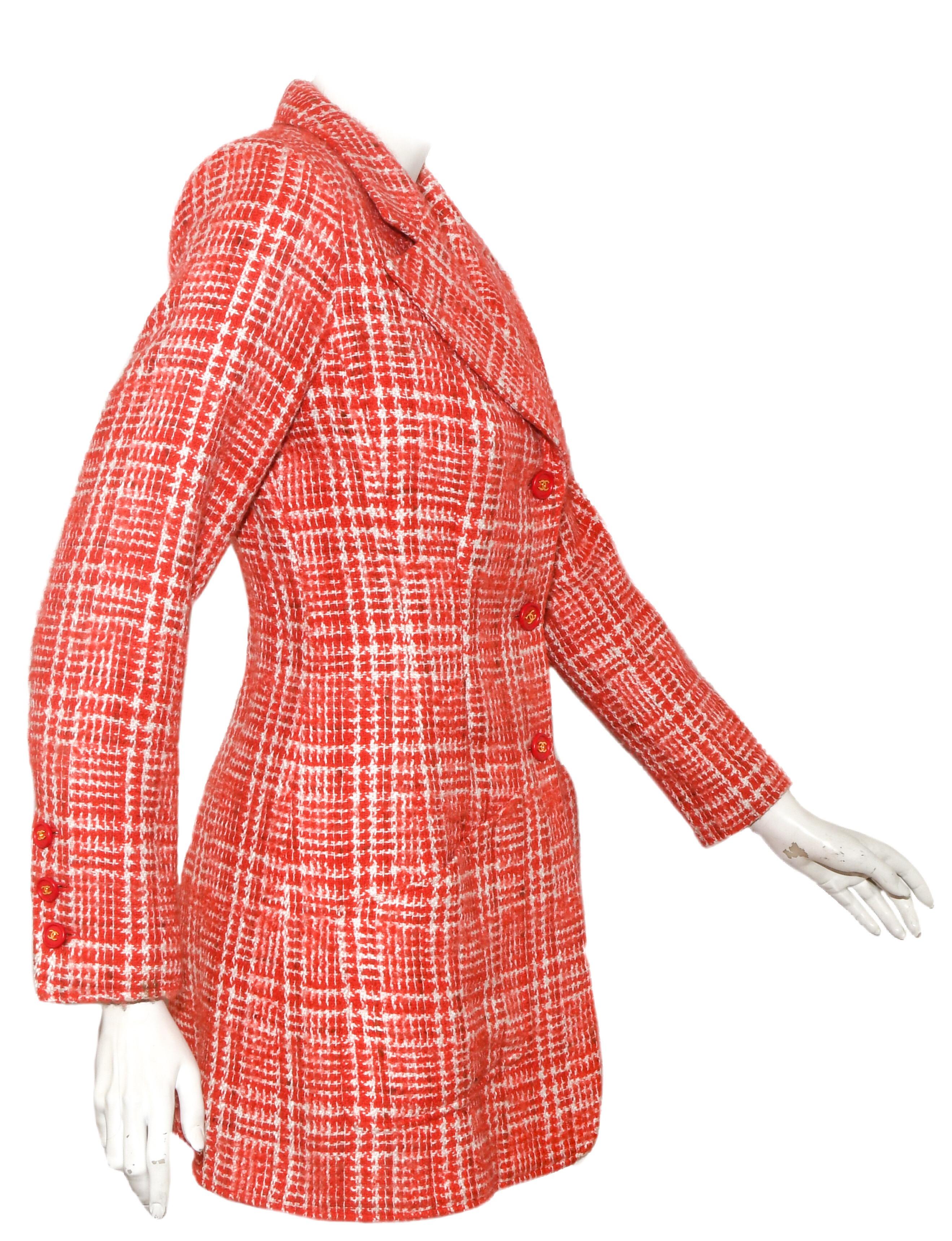 Chanel wool blend long jacket from the Spring '97 has three orange and gold tone buttons along the front center, for closure, also, on the cuffs. Two small slip pockets at the hem.  Lined in orange CC silk fabric. This jacket is in excellent