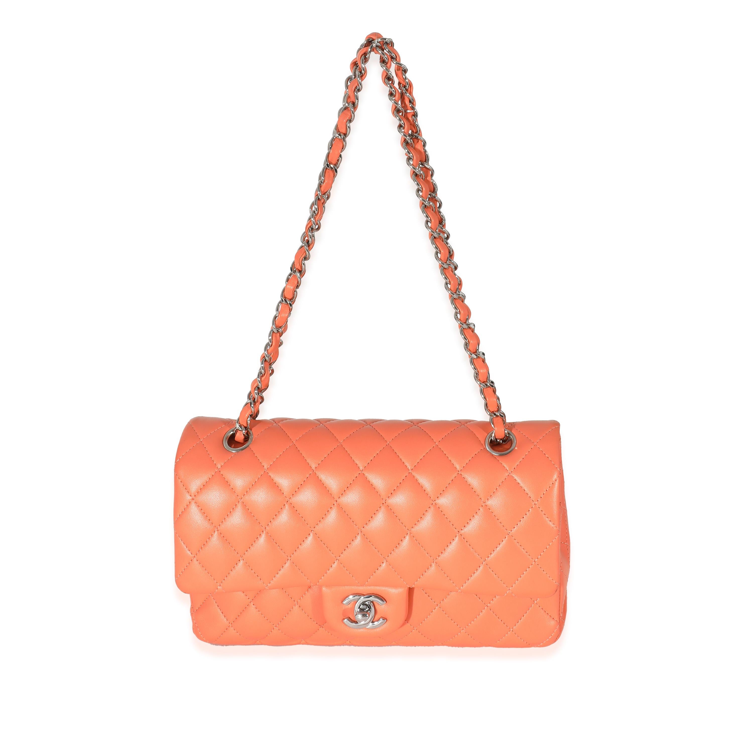 Listing Title: Chanel Orange Quilted Lambskin Medium Classic Double Flap Bag
SKU: 134010
Condition: Pre-owned 
Handbag Condition: Very Good
Condition Comments: Item is in very good condition with minor signs of wear. Exterior heavy scuffing, marks