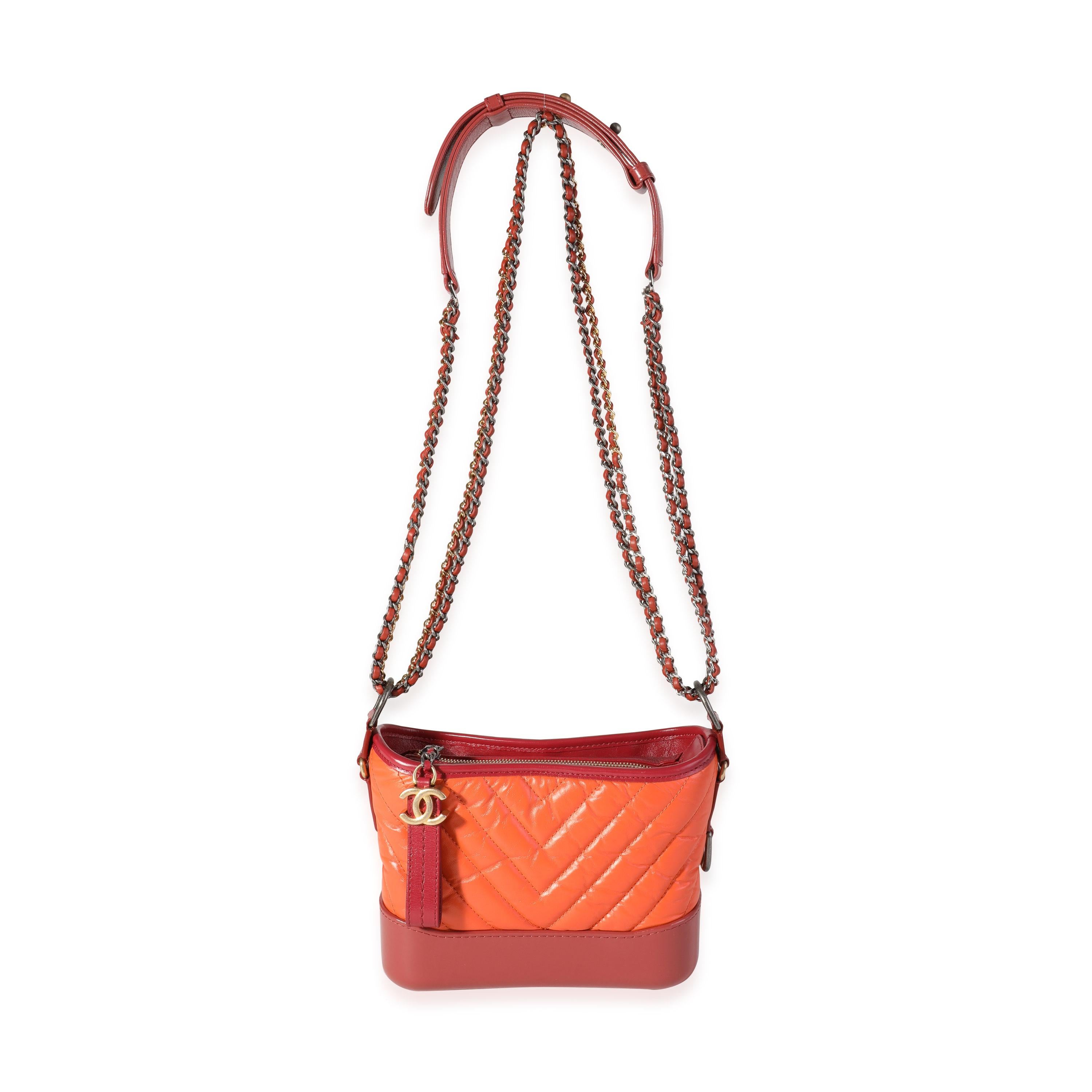 Listing Title: Chanel Orange & Red Aged Calfskin Chevron Quilted Small Gabrielle Hobo
SKU: 118096
MSRP: 5000.00
Condition: Pre-owned (3000)
Handbag Condition: Excellent
Condition Comments: Excellent Condition. Light scuffing to leather. No other