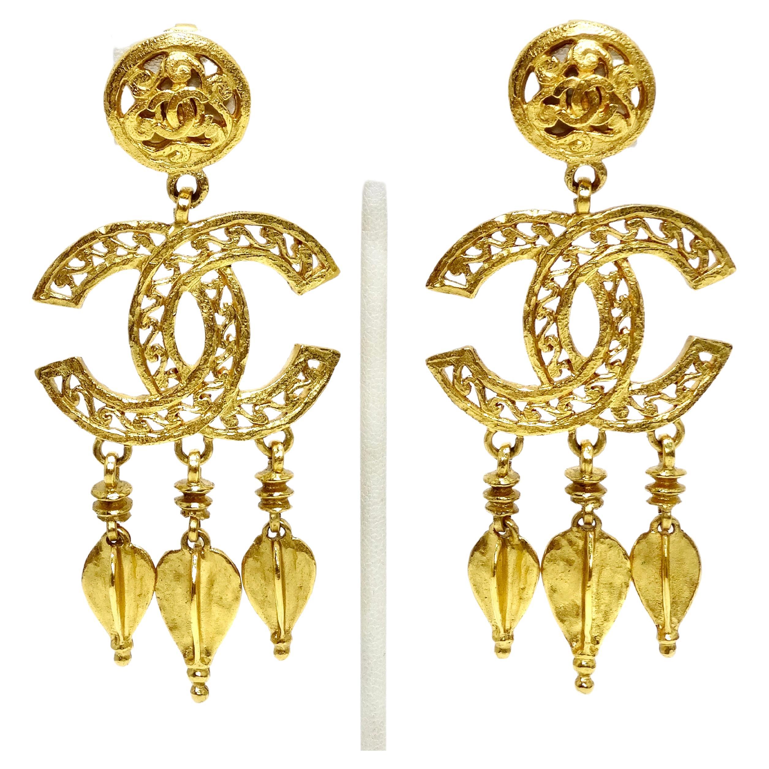 These are a rare pair of Chanel earrings that includes a load of ornate details. It features a large 