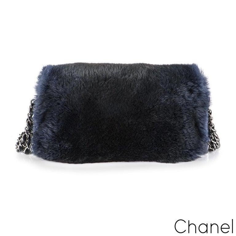 A stylish and Chic Chanel Orylag flap bag from the Fall/Winter 2015 Act 1 Collection. The exterior of this bag features a navy orylag fur with antiqued silver-tone hardware. It has the signature CC turn-lock closure at front single along with triple