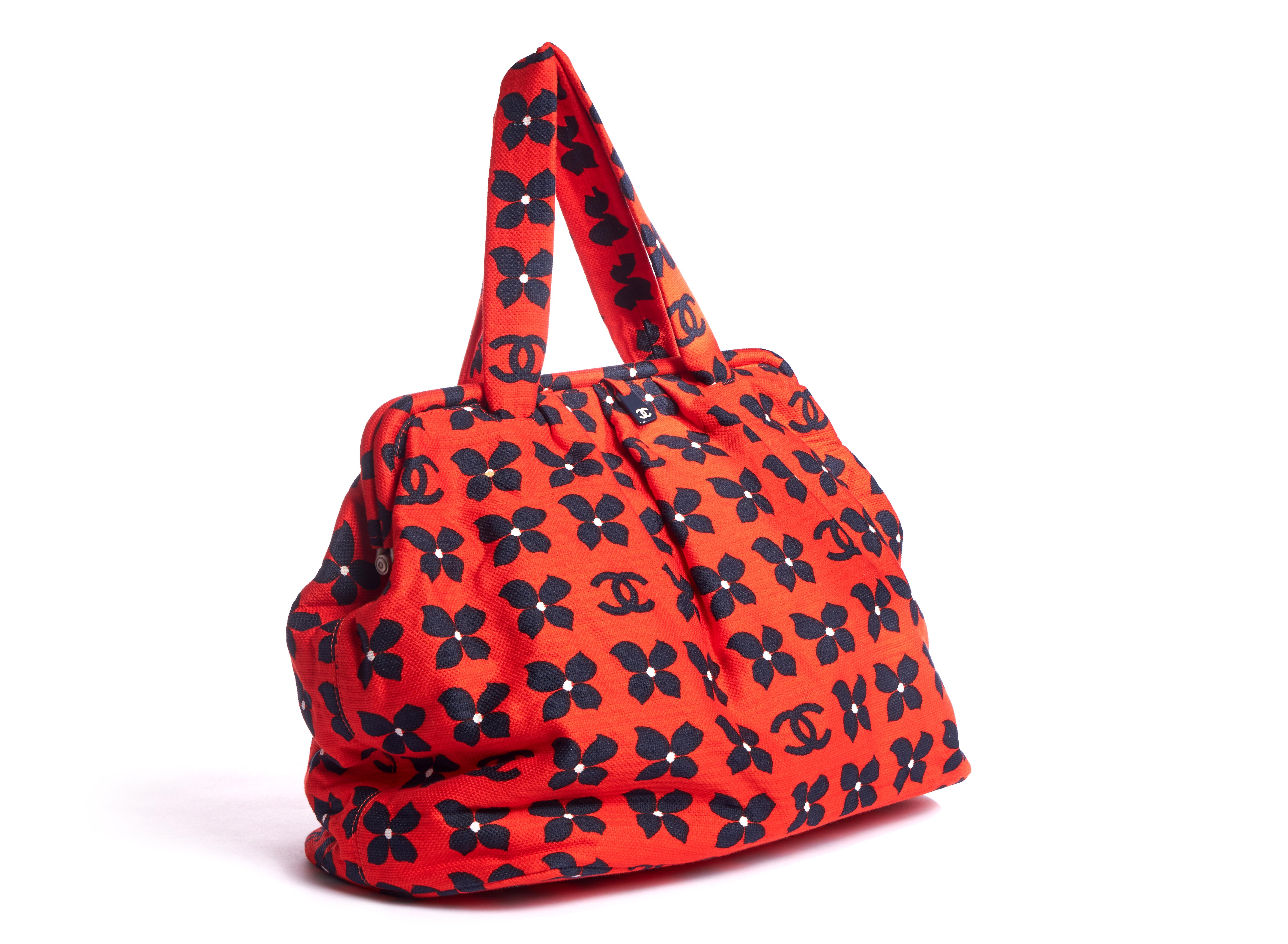 Chanel oversize fun fabric bag with snap closure. Orange with navy blue logo and clovers design. Handle drop 8