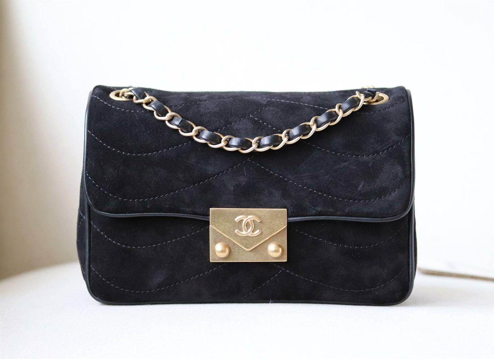 Chanel Pagoda Quilted Suede Flap Small Bag has been hand-finished by skilled artisans in the label's workshop.
Boasting a soft quilted suede and leather exterior with lambskin-leather trim, this design is accented with gold-toned and black