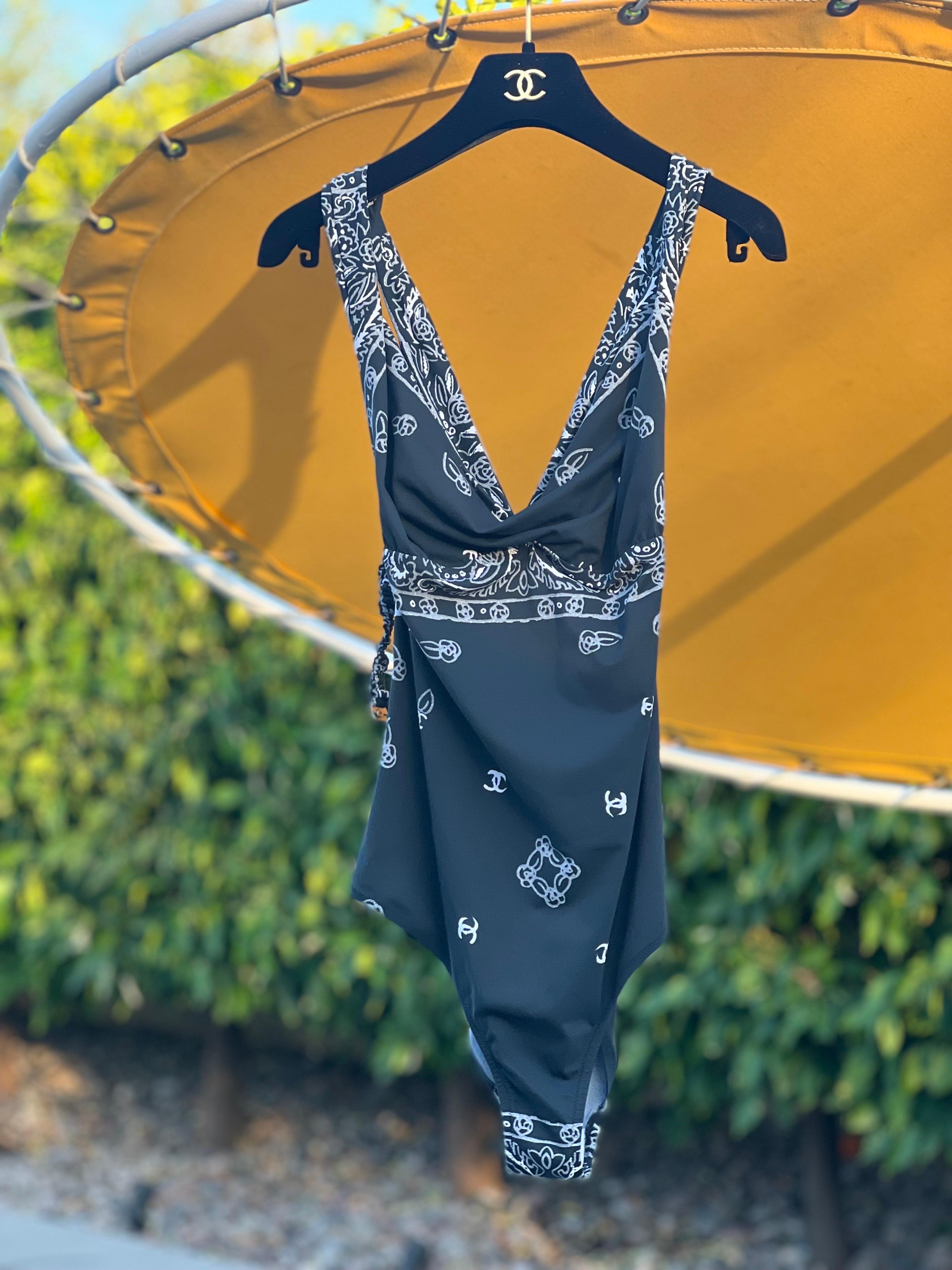 Doesn't it feel good to be the most fashionable one in the room? With the purchase of this chic and fun Chanel swimsuit, you'll be the most fashionable at any pool party! Name something better than Chanel SWIM! Chanel does such a smart job with this