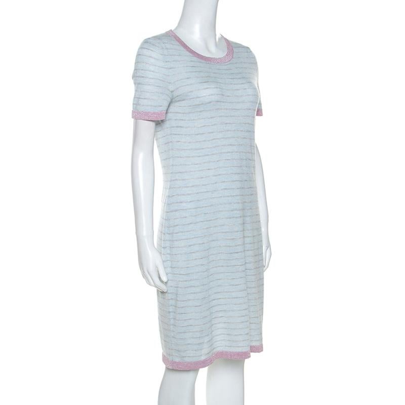Coming from the globally recognized house of Chanel, this dress is a treasure and a wardrobe classic. Crafted from a lovely cashmere blend, it features a gorgeous pale blue color. It has been cut to offer a simple silhouette that exudes effortless