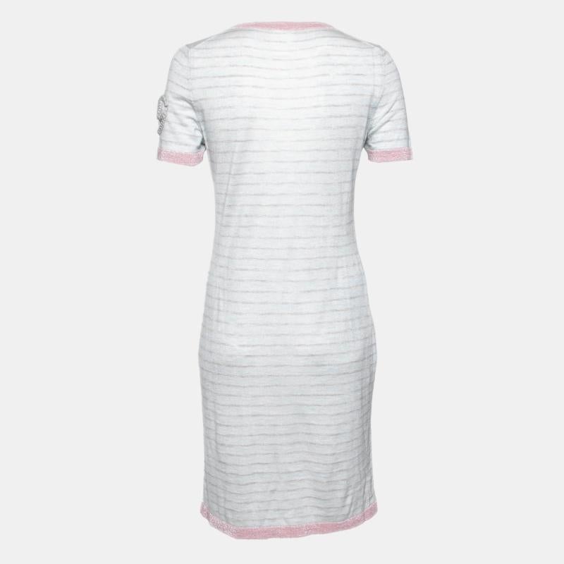 Achieve a comfortable and casual style with this dress from the House of Chanel. It is created using pale-blue striped cashmere knit fabric, which is embellished with contrasting pink trims and logo embroidery. It has short sleeves and a relaxed