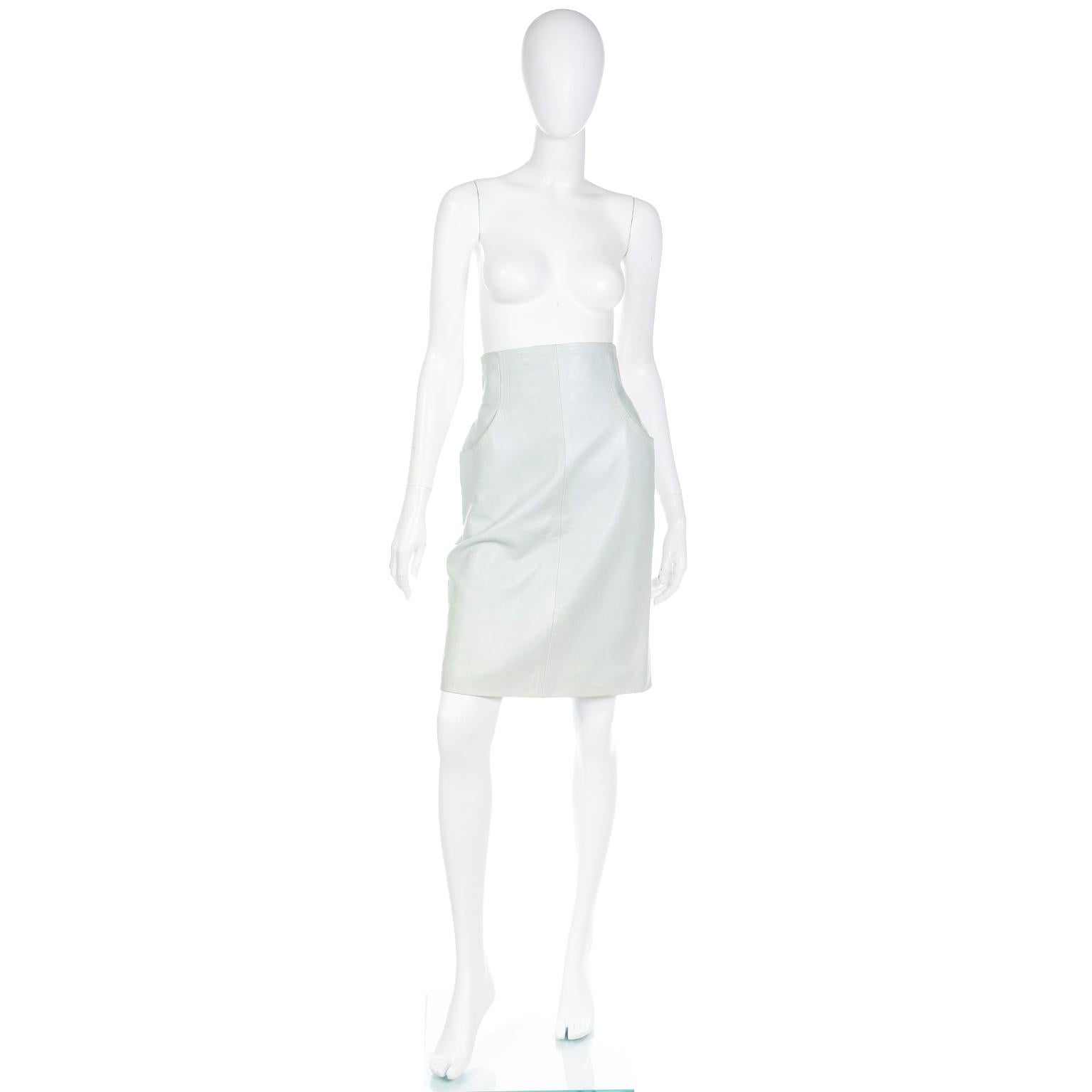 This gorgeous Chanel pale mint green lambskin leather skirt is such a fabulous piece with a great high waist and lovely details. This opaque 100% lambskin leather skirt has signature CC monogram silk lining and unique zig zag topstitching along