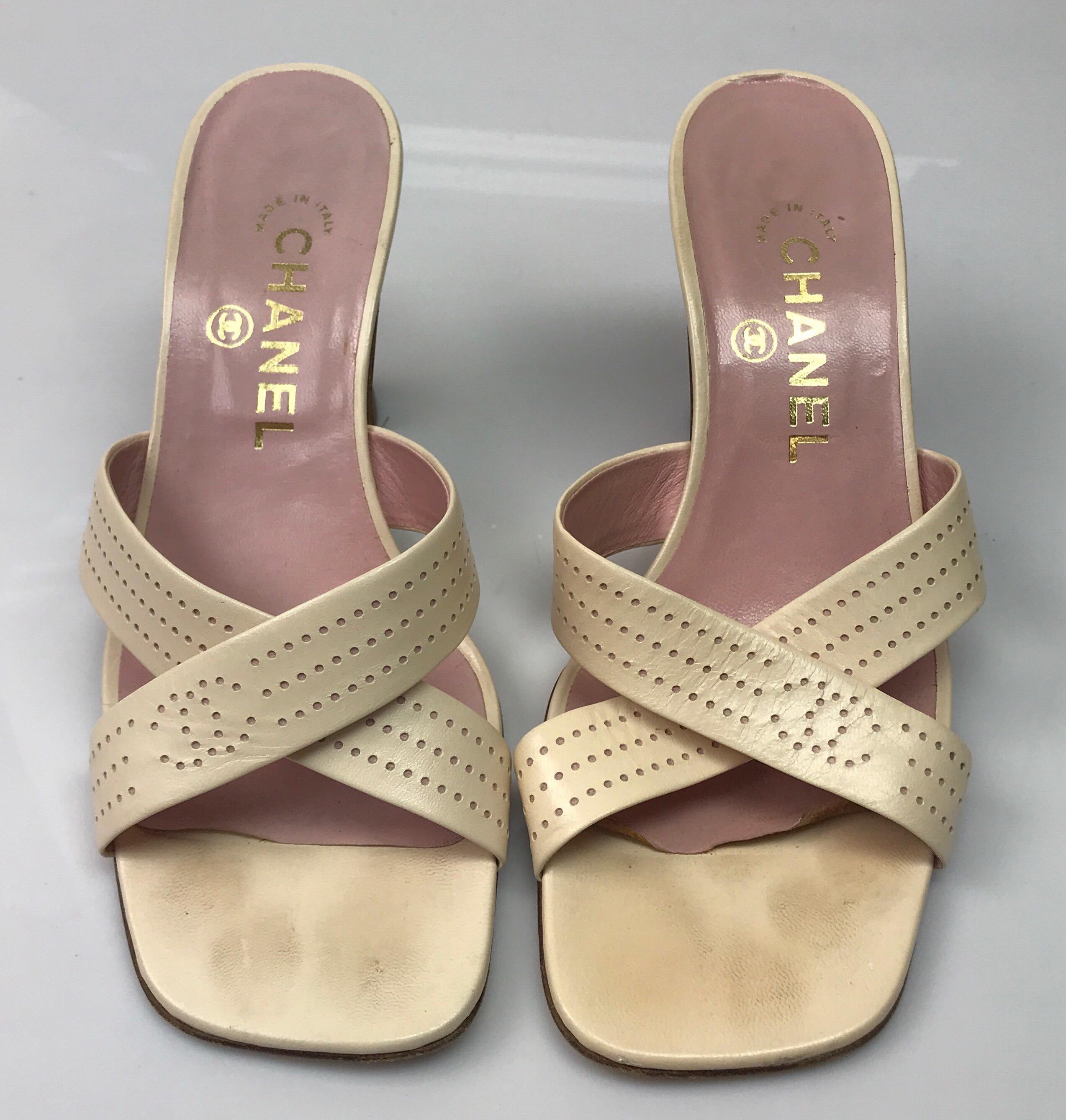 Chanel Pale Pink Perforated Leather Strappy Sandal - 37. These adorable Chanel short heels are in good condition. They show minor toe marks, wear on the bottom, and the sole is slightly peeling away, shown in picture. They are a pale pink leather