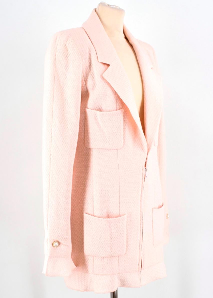 Chanel Pink Blazer & Trousers 

- Long sleeved blazer 
- Zip closure 
- 4 front pockets 
- Pearl button details 
- Slight frill hemline and cuffs 
- Signature double C on the cuffs 
- Straight leg trousers 
- Button and hidden zip fastening 
-