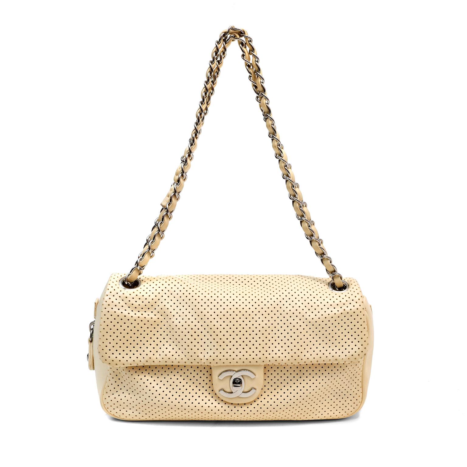 This authentic Chanel Pale Yellow Perforated Leather Baseball Spirit Flap Bag is in excellent plus condition. Perfectly scaled in the medium silhouette, this flap bag is ready to go anywhere day or evening.  Pale yellow perforated leather flap bag
