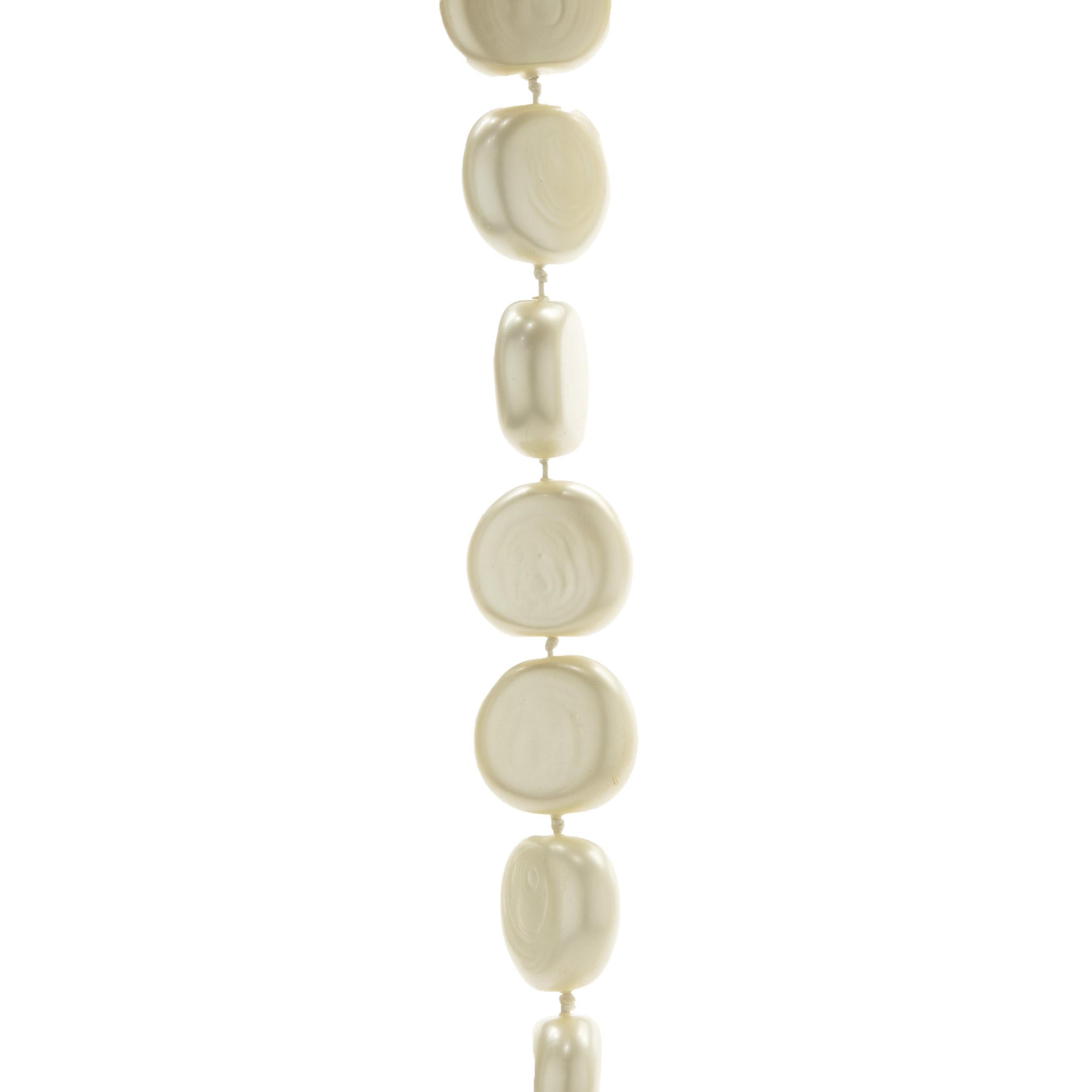 Designer: Chanel
Material: pancake pearls
Weight: 238.43 grams
Dimensions: necklace measures 28-inches