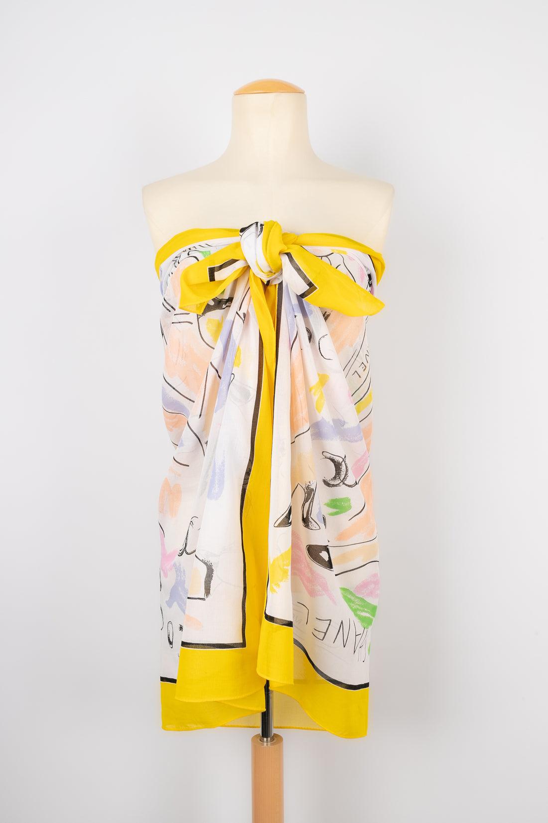 Chanel - Large pareo-style stole made of yellow cotton and illustrated with shoes. The composition label is missing.

Additional information:
Condition: Very good condition
Dimensions: 105 cm x 150 cm

Seller Reference: FFC24